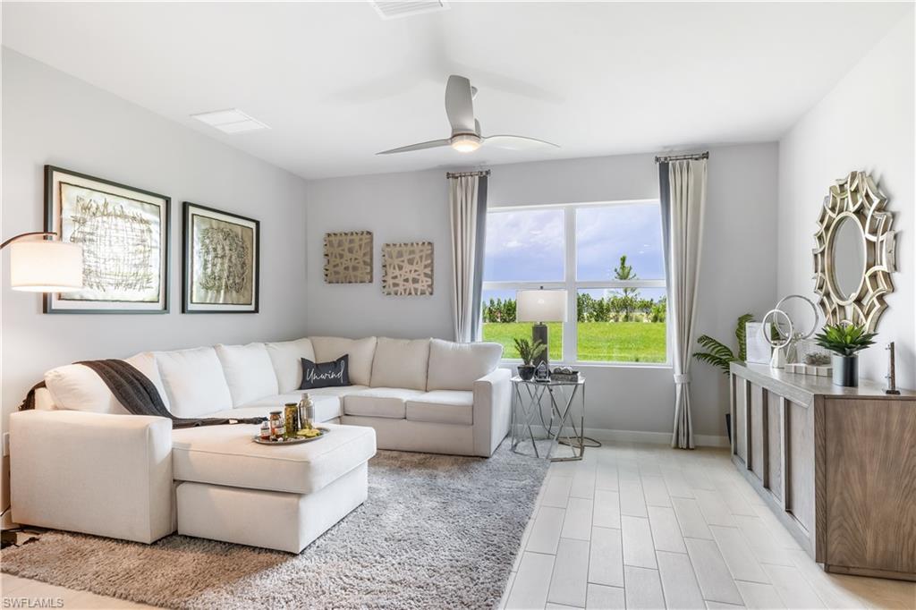 17767 Shade Tree Loop Punta Gorda, FL 33982 - Photo 3 of 35 a living room with furniture and a potted plant