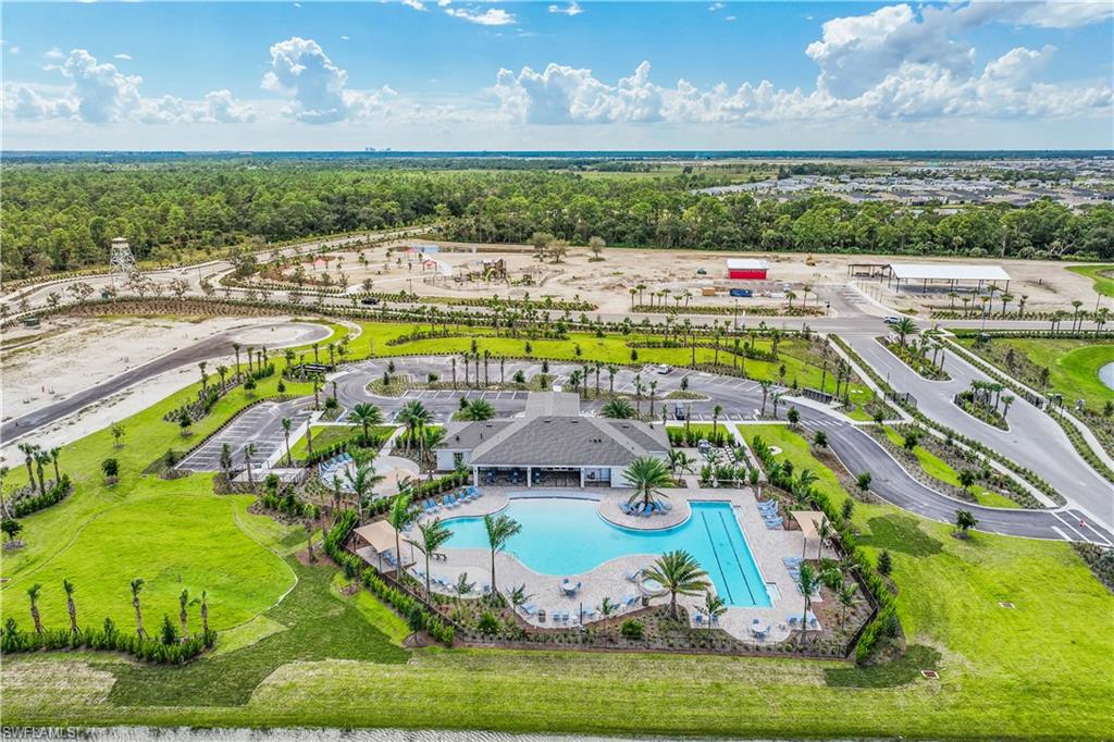 17767 Shade Tree Loop Punta Gorda, FL 33982 - Photo 32 of 35 a view of swimming pool with outdoor seating and yard