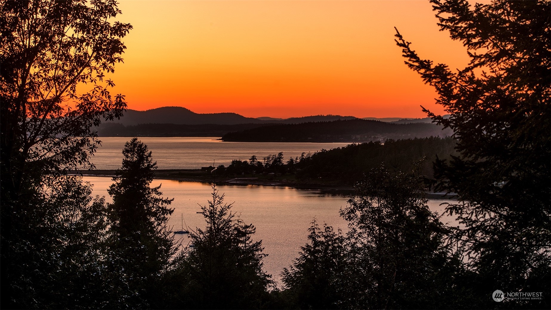 a view of lake with mountain in the back