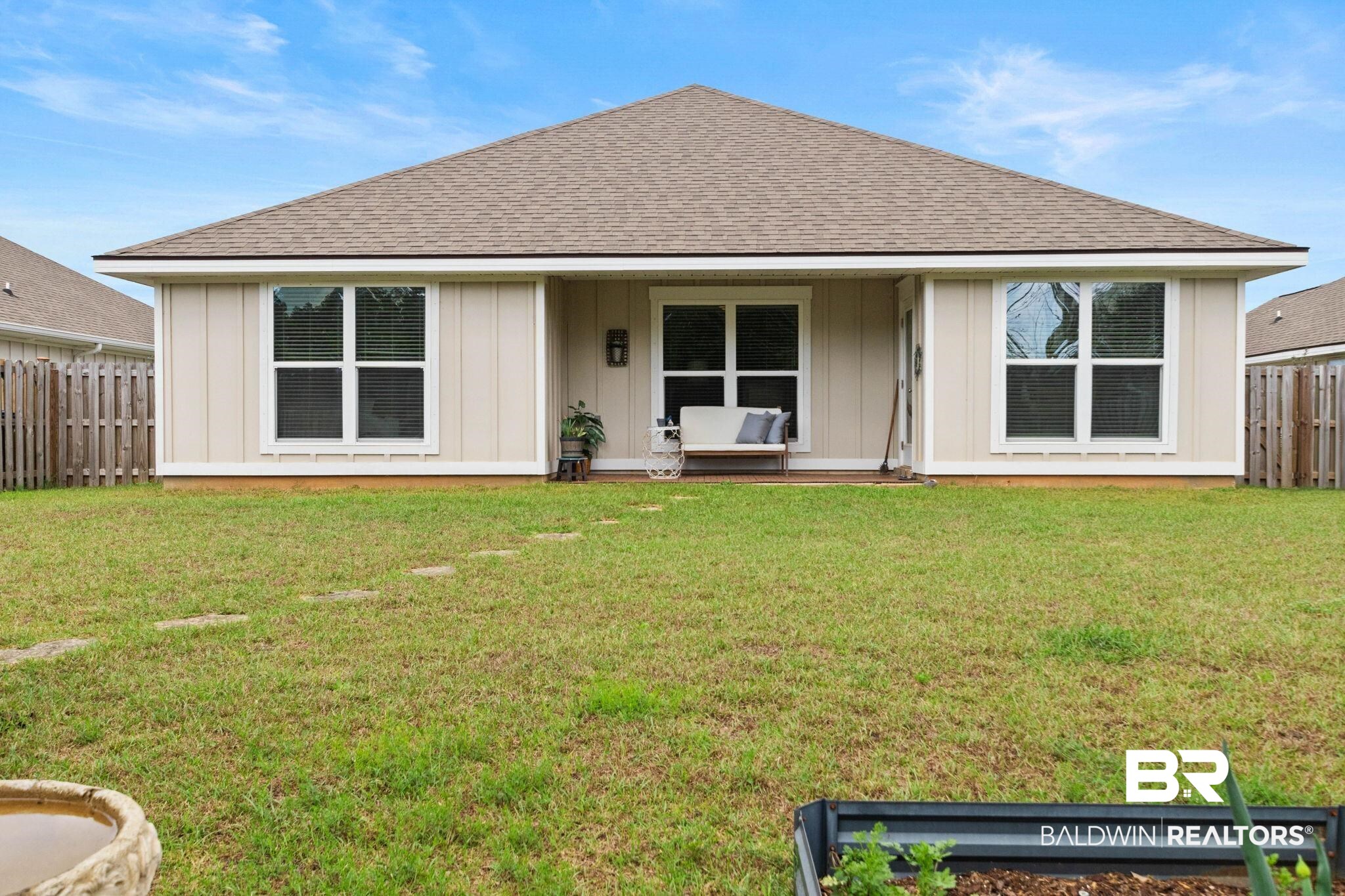 1203 Hayward Loop Foley, AL 36535 - Photo 33 of 41 Rear view of property with a shingled roof and board and batten siding