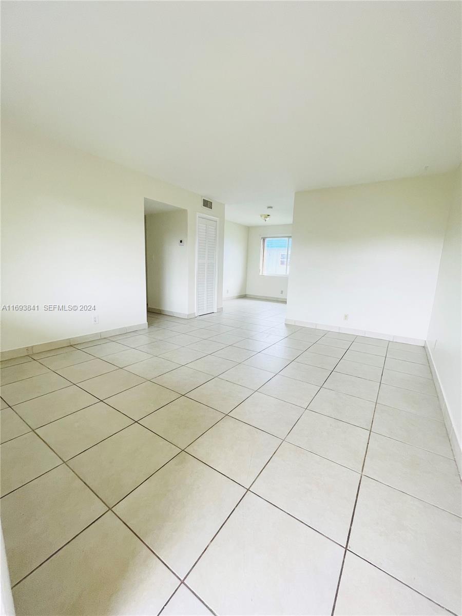 5261 Southwest 90th Way, Unit 3 Cooper City, FL 33328 - Photo 7 of 7 a view of an empty room and a window