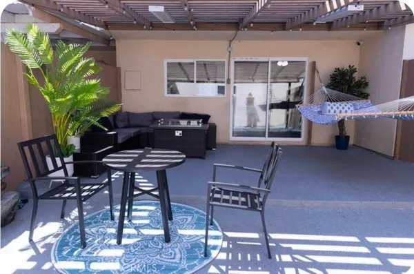 a outdoor space with a couch and chairs