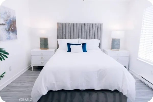 a view of a hallway with a large mirror on a wall