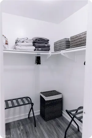 a view of a dinning room with furniture and a potted plant