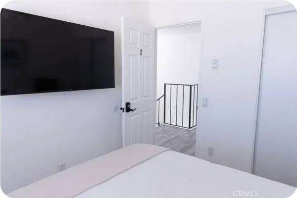 a bedroom with a bed and furniture