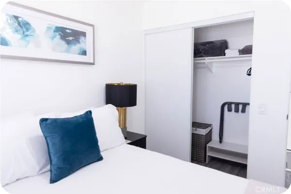 a bedroom with a bed and furniture