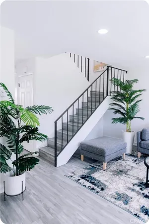 a view of entryway with wooden floor