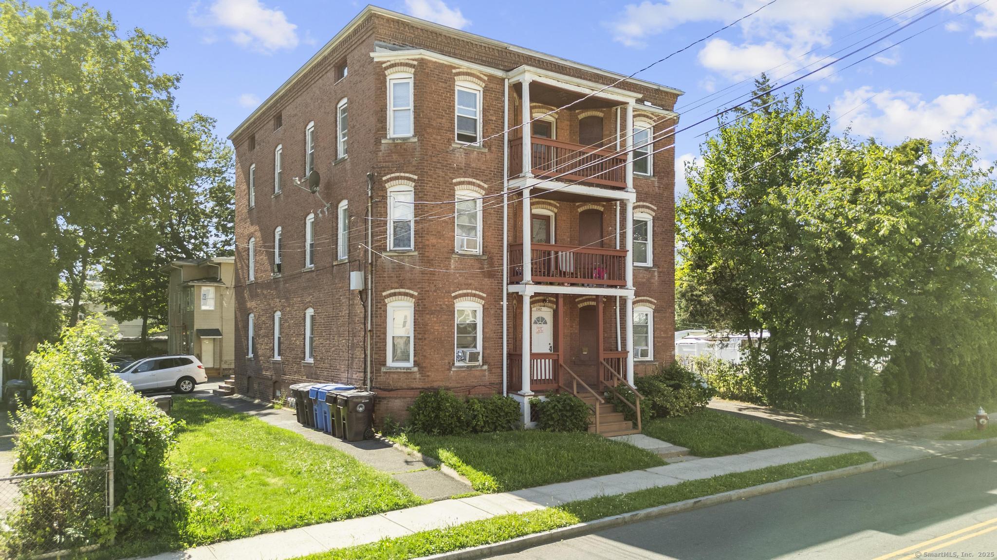 front view of a house with a yard