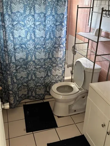 a bathroom with a toilet and a sink