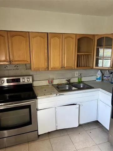 a kitchen with a cabinets and appliances