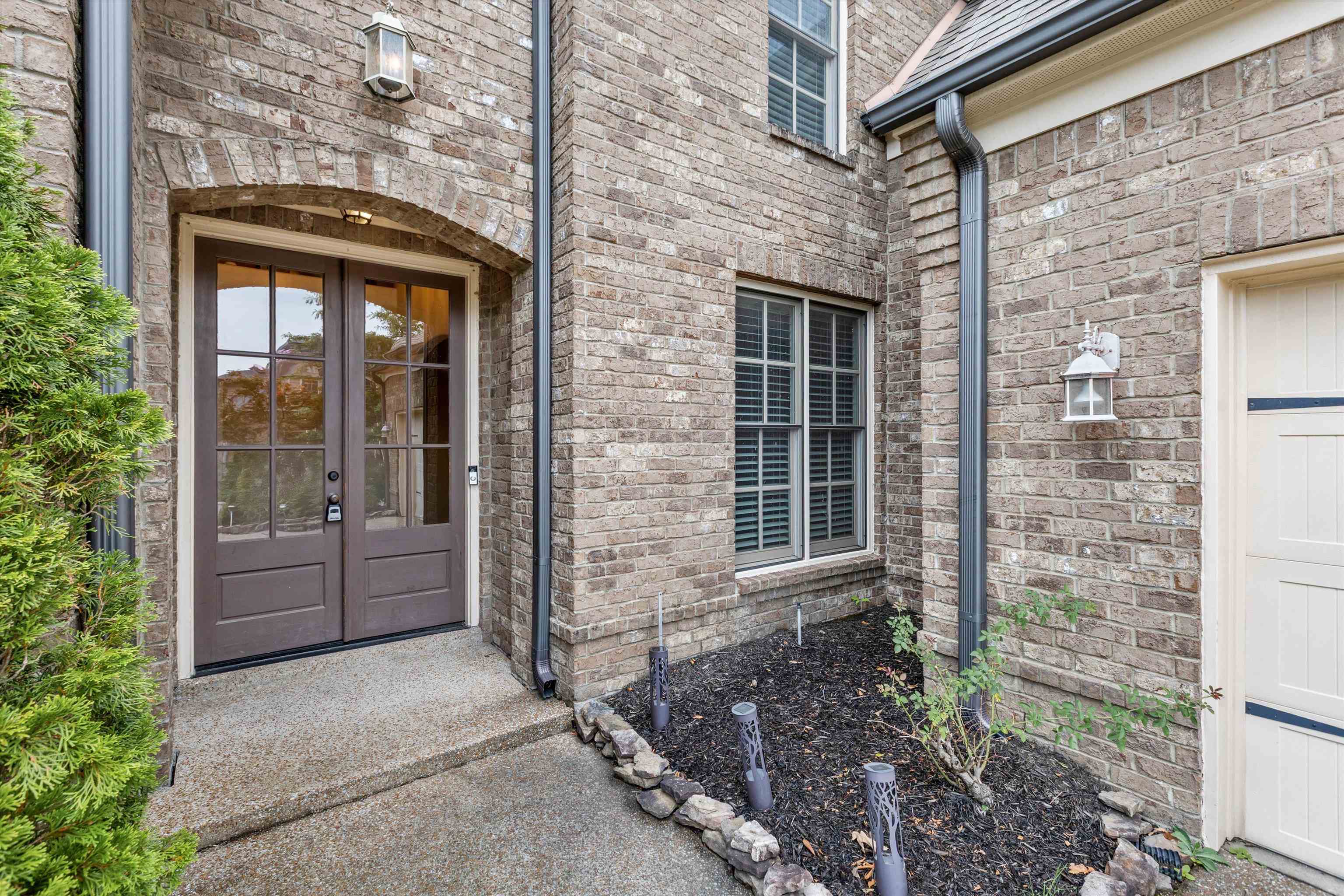 1651 Dehaig Lane Collierville, TN 38017 - Photo 2 of 36 a front view of a house with a yard
