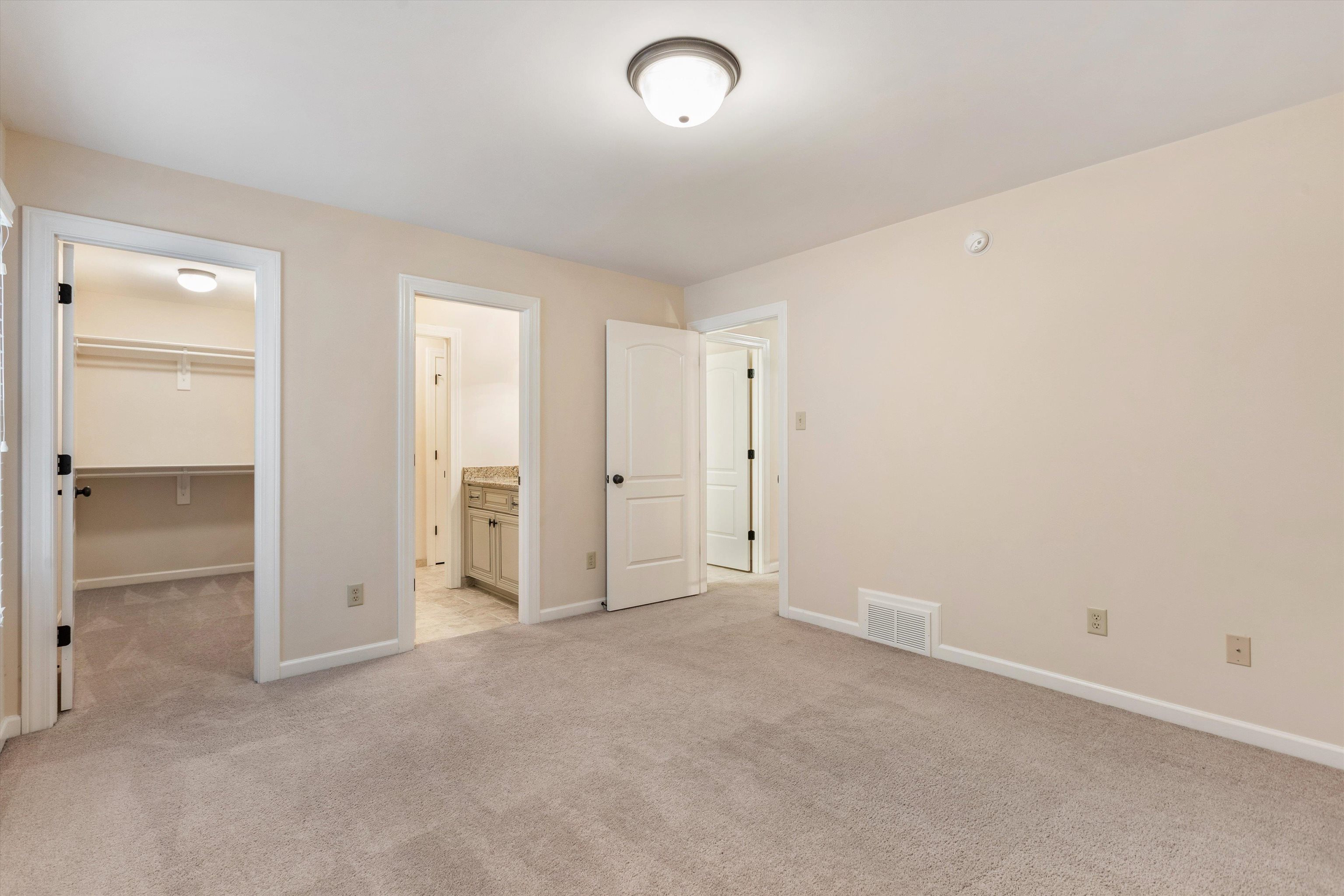 1651 Dehaig Lane Collierville, TN 38017 - Photo 24 of 36 an empty room with closet area and mirrors