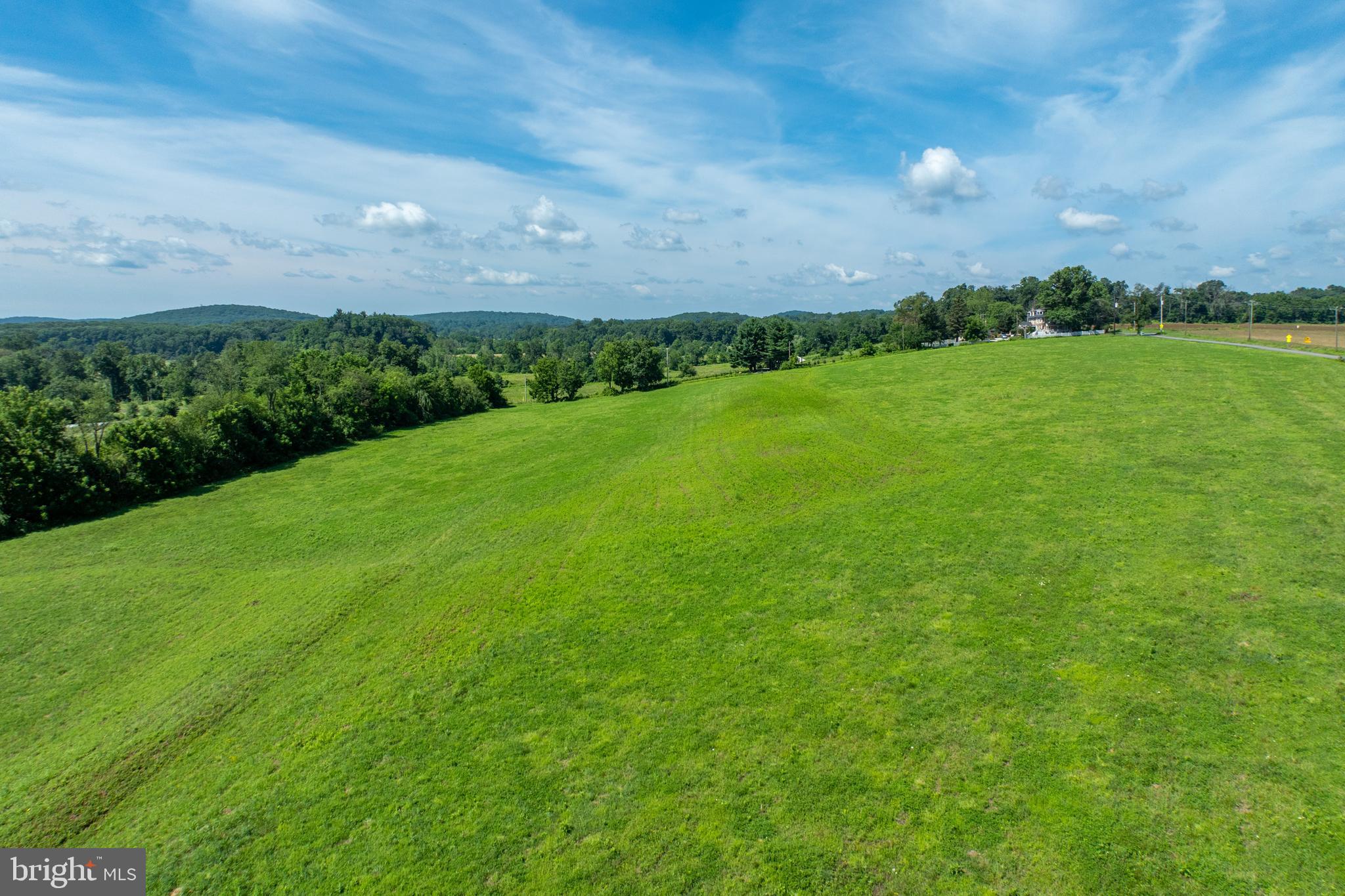 1700 St Matthews Road Phoenixville, PA 19460 - Photo 12 of 16 a view of a grassy field with an trees