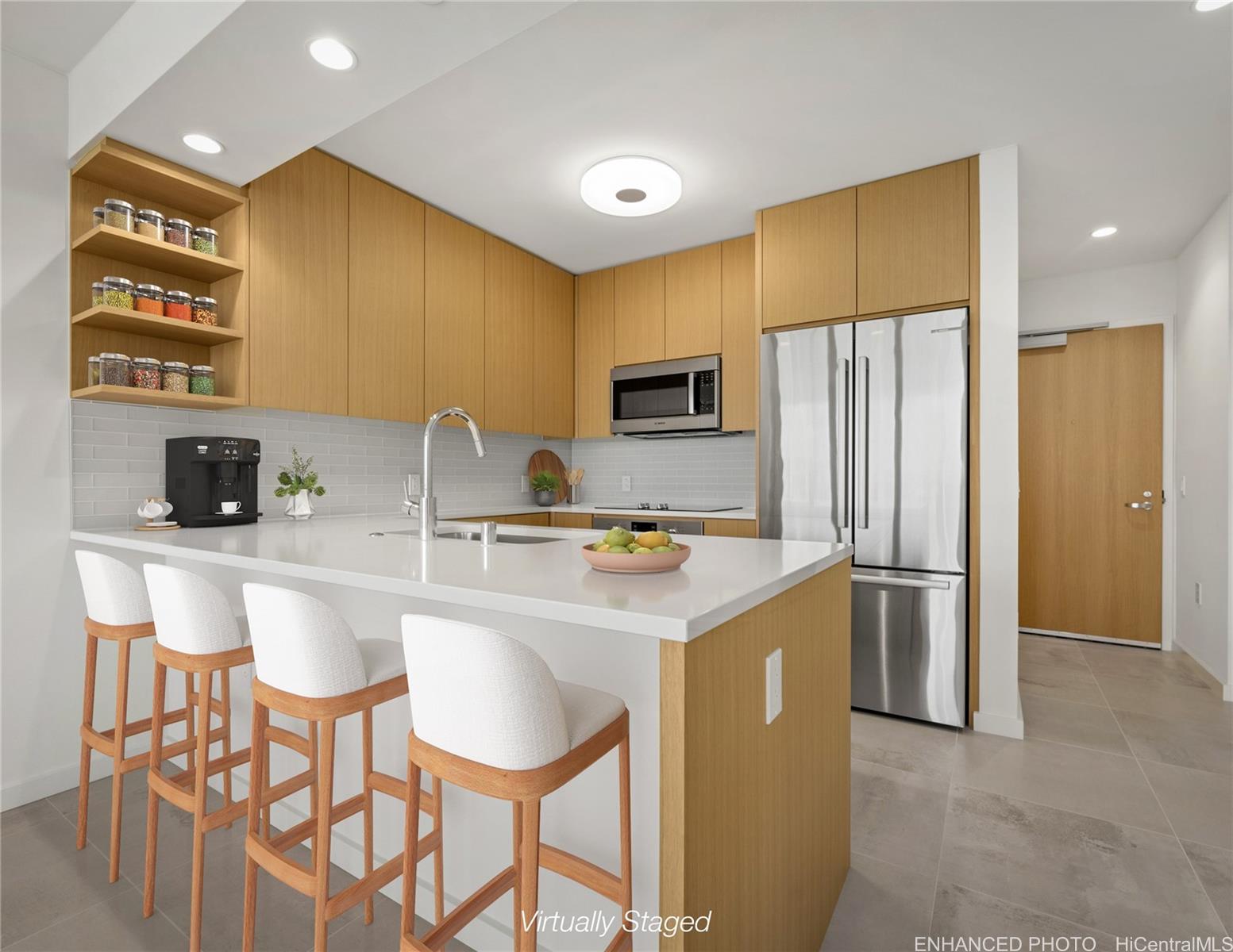 a kitchen with stainless steel appliances granite countertop a sink a stove a refrigerator with white cabinets and wooden floor
