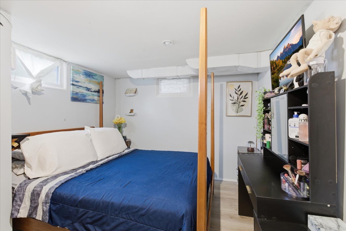 270 Ridge Avenue Crystal Lake, IL 60014 - Photo 12 of 19 a bedroom with a bed and wooden floor