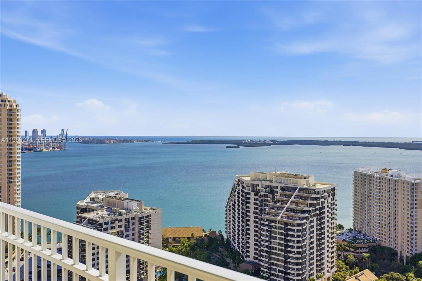 801 Brickell Key Boulevard, Unit 3209 Miami, FL 33131 - Photo 2 of 24 a view of a balcony with an ocean view