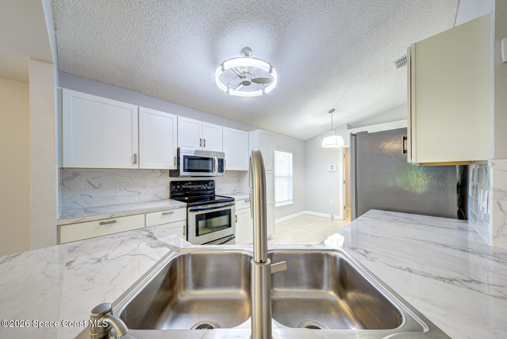3353 Echo Ridge Place Cocoa, FL 32926 - Photo 13 of 51 kitchen view from bar