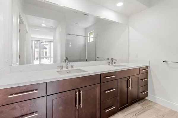 a bathroom with a sink and mirror