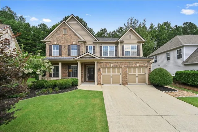 a front view of a house with a yard