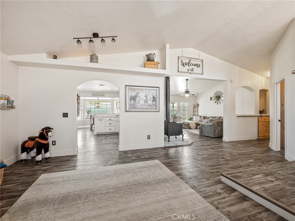 6370 Fremontia Road Hesperia, CA 92344 - Photo 14 of 62 a living room with furniture and a refrigerator