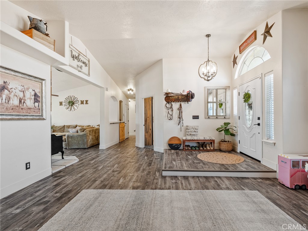 6370 Fremontia Road Hesperia, CA 92344 - Photo 15 of 62 a living room with furniture and a large window