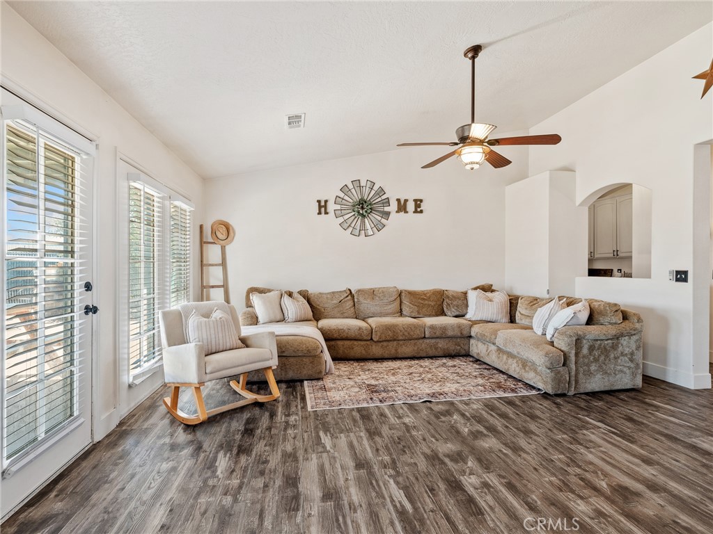 6370 Fremontia Road Hesperia, CA 92344 - Photo 19 of 62 a living room with furniture and a chandelier