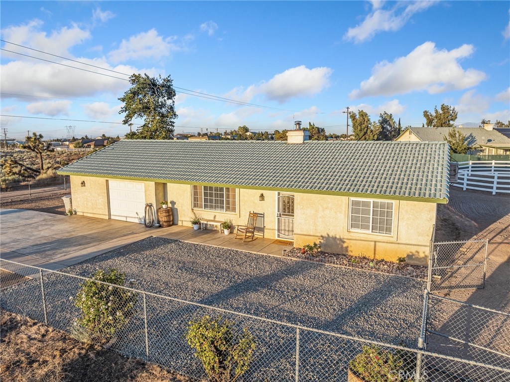 6370 Fremontia Road Hesperia, CA 92344 - Photo 46 of 62 a view of a house with a backyard