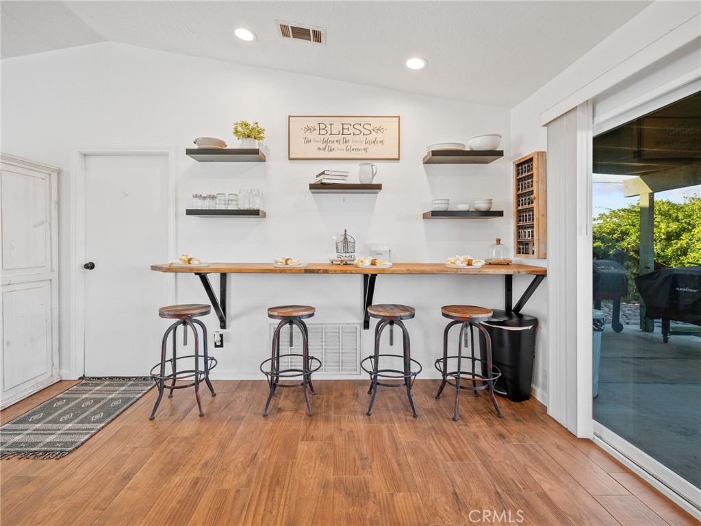 6370 Fremontia Road Hesperia, CA 92344 - Photo 54 of 62 a view of a dining room with furniture and wooden floor