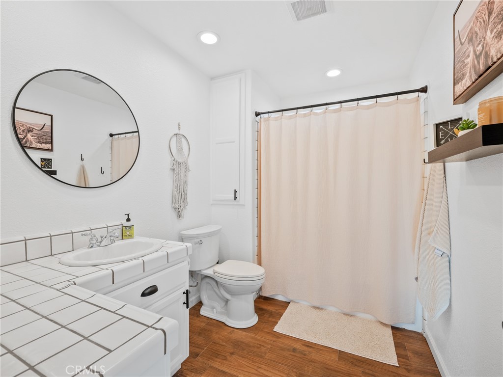 6370 Fremontia Road Hesperia, CA 92344 - Photo 57 of 62 a bathroom with a sink and a mirror