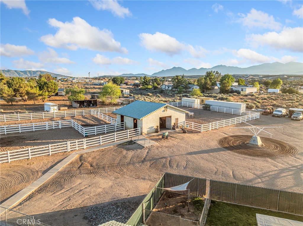 6370 Fremontia Road Hesperia, CA 92344 - Photo 7 of 62 a view of a terrace with lawn chairs