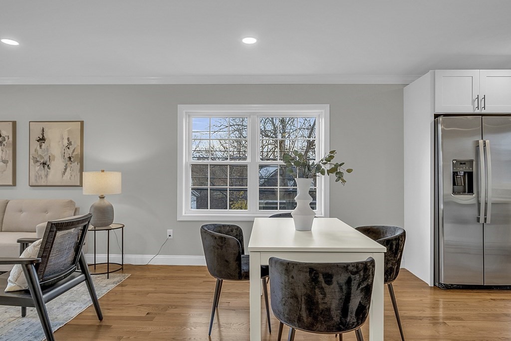 30 Broadway, Unit A Lynn, MA 01904 - Photo 14 of 34 a dining room with furniture and window