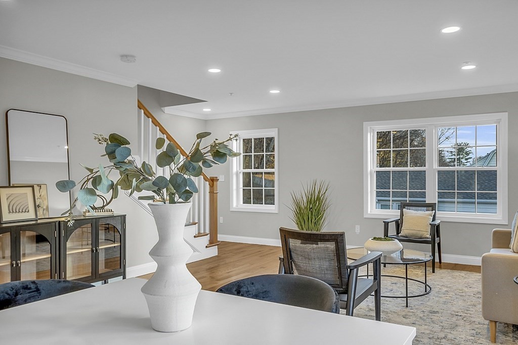 30 Broadway, Unit A Lynn, MA 01904 - Photo 16 of 34 a living room with furniture potted plant and a table