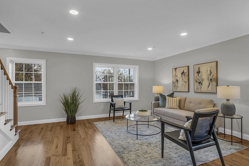 30 Broadway, Unit A Lynn, MA 01904 - Photo 17 of 34 a living room with furniture and wooden floor