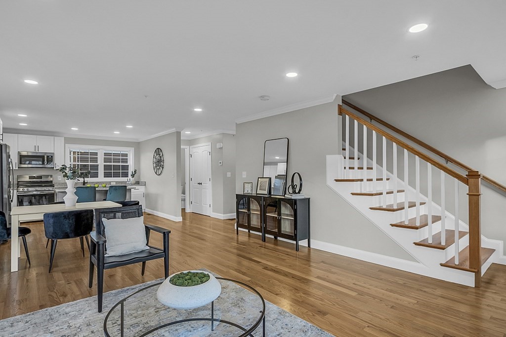 30 Broadway, Unit A Lynn, MA 01904 - Photo 20 of 34 a living room with furniture and wooden floor