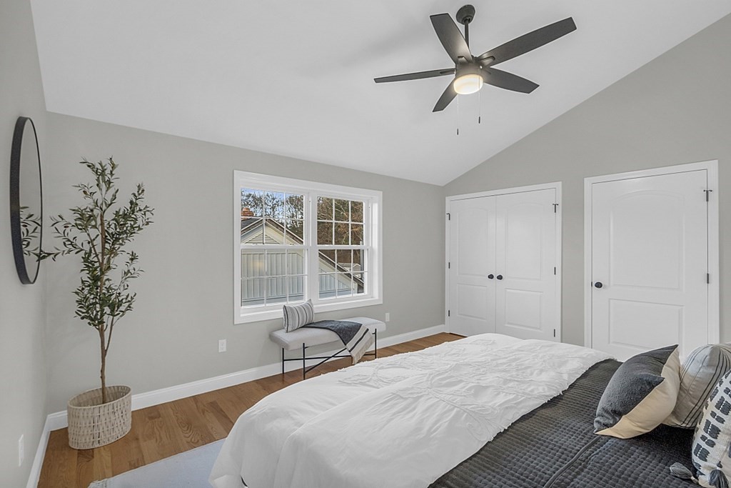 30 Broadway, Unit A Lynn, MA 01904 - Photo 23 of 34 a bedroom with a bed and a window