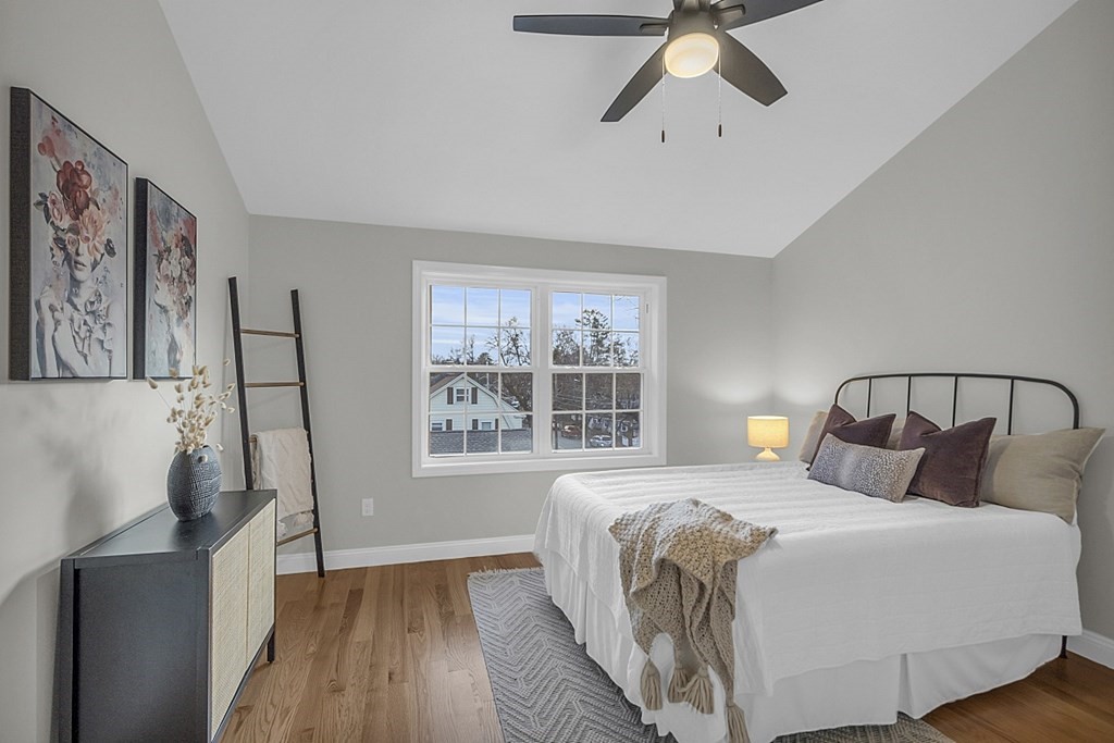 30 Broadway, Unit A Lynn, MA 01904 - Photo 24 of 34 a bedroom with a large bed and a window