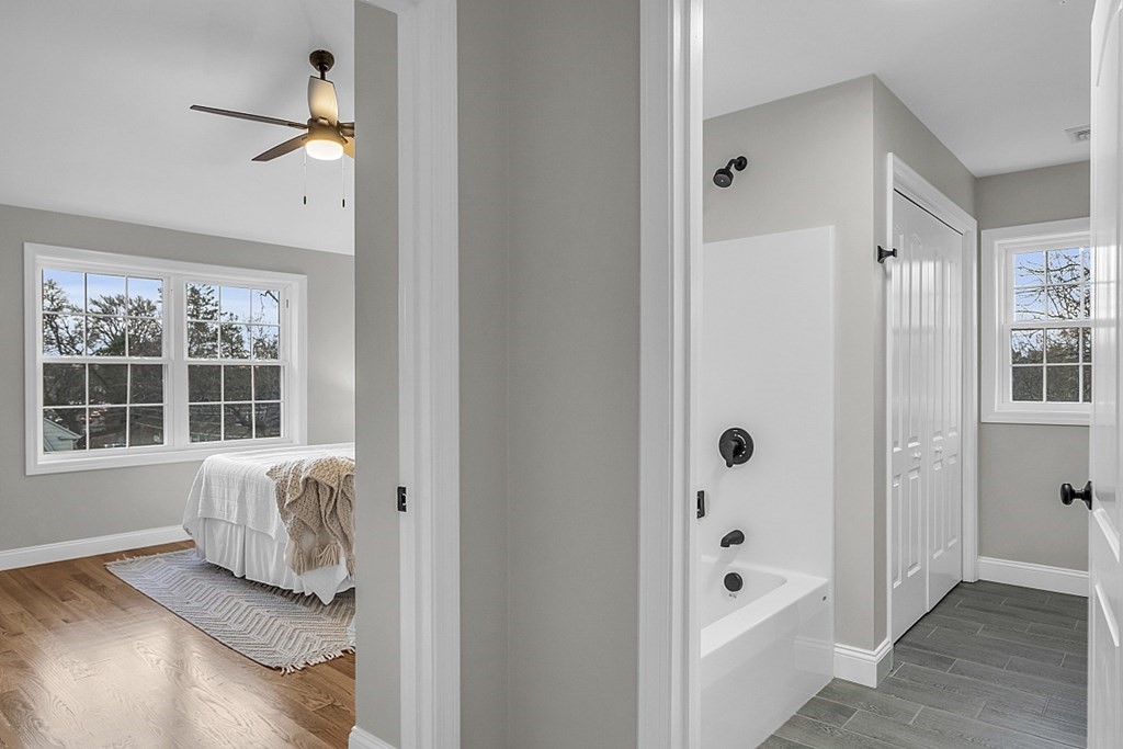 30 Broadway, Unit A Lynn, MA 01904 - Photo 27 of 34 a view of a hallway with wooden floor and a cabinet