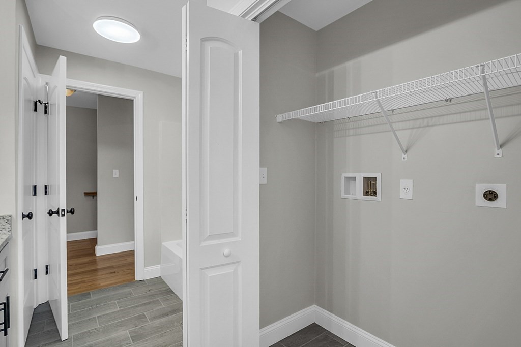 30 Broadway, Unit A Lynn, MA 01904 - Photo 29 of 34 a view of a hallway with wooden floor