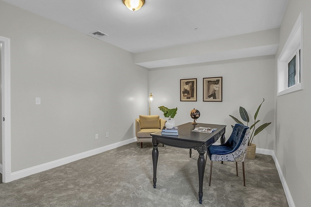 30 Broadway, Unit A Lynn, MA 01904 - Photo 30 of 34 a workspace with furniture and a potted plant