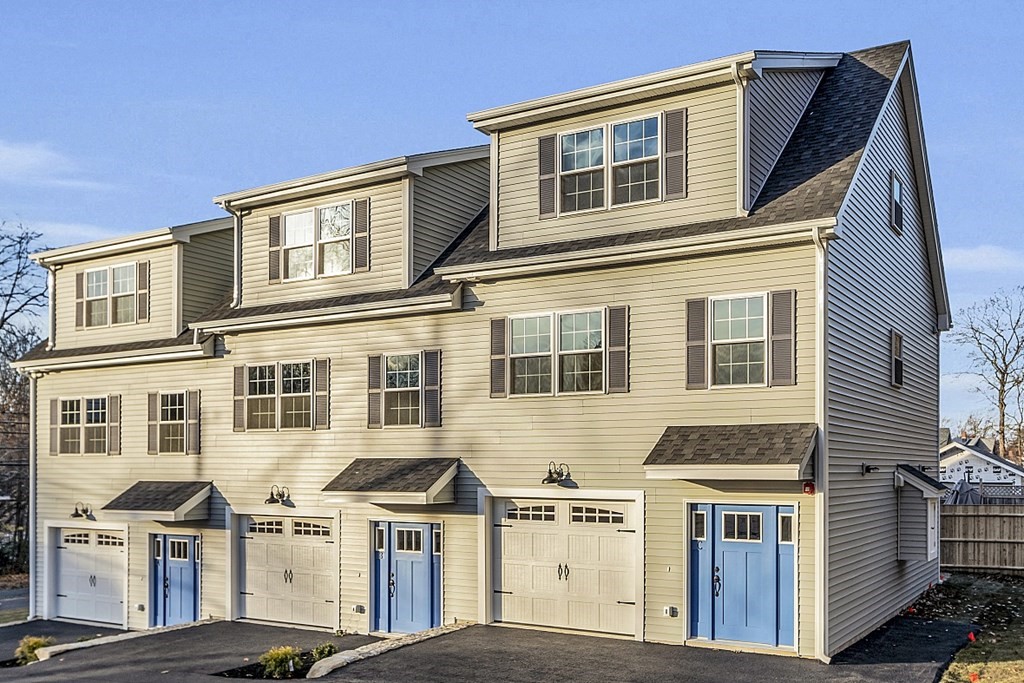 30 Broadway, Unit A Lynn, MA 01904 - Photo 4 of 34 a front view of residential houses with street