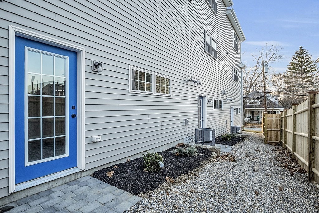 30 Broadway, Unit A Lynn, MA 01904 - Photo 7 of 34 a view of a house with a yard