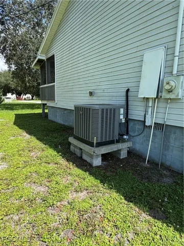 a view of a park with large trees