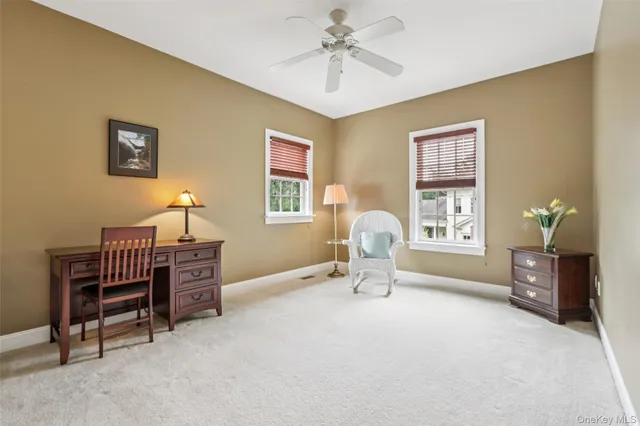 a living room with furniture a window and a chandelier