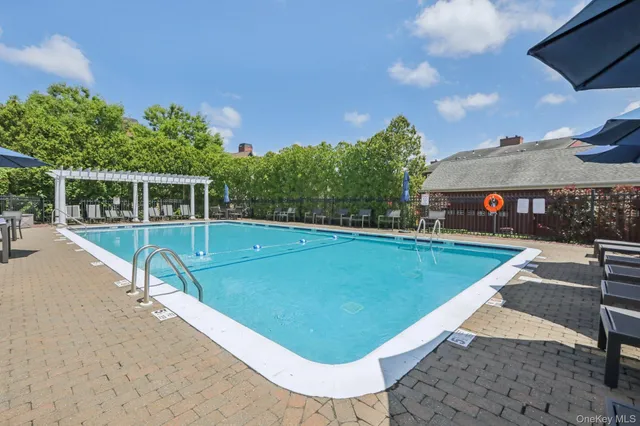 a view of a swimming pool with a patio