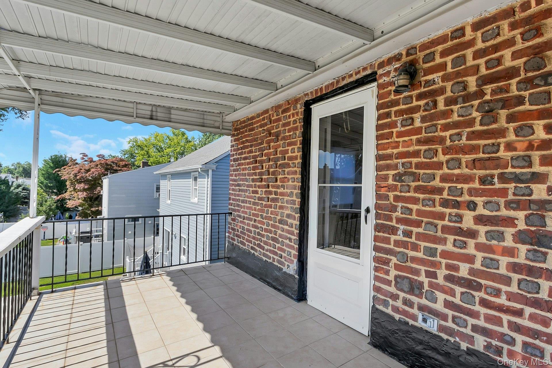 64 Lyons Road, Unit 2 / 2 Scarsdale, NY 10583 - Photo 19 of 42 balcony off primary bedroom