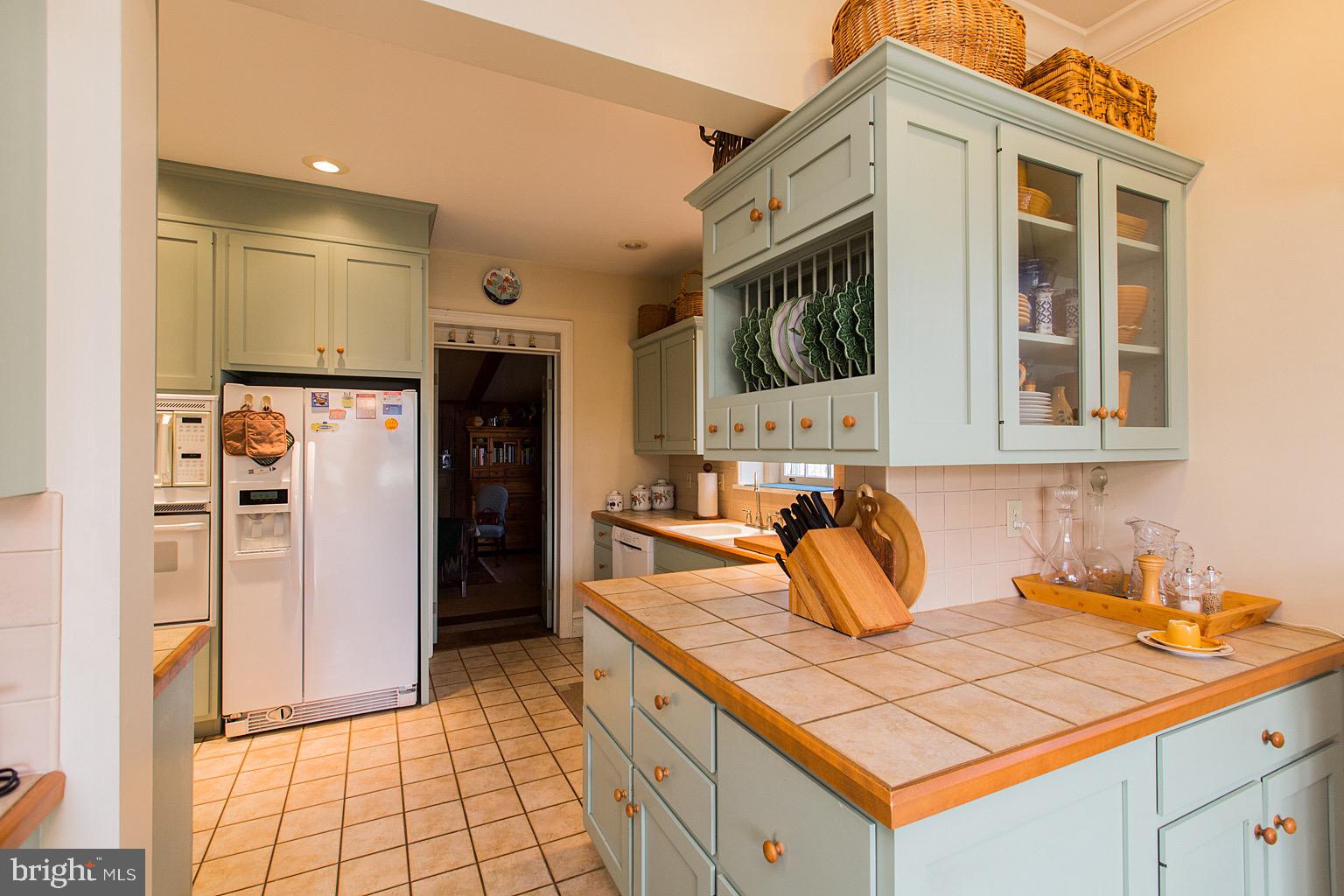 41 Hess Boulevard Lancaster, PA 17601 - Photo 16 of 63 a kitchen with stainless steel appliances kitchen island granite countertop a refrigerator and a sink
