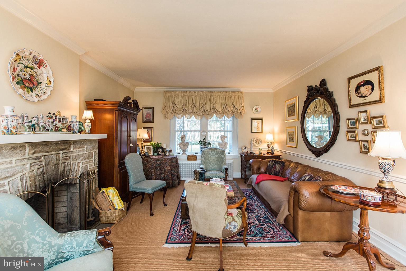 41 Hess Boulevard Lancaster, PA 17601 - Photo 30 of 63 a living room with furniture a clock and a fireplace