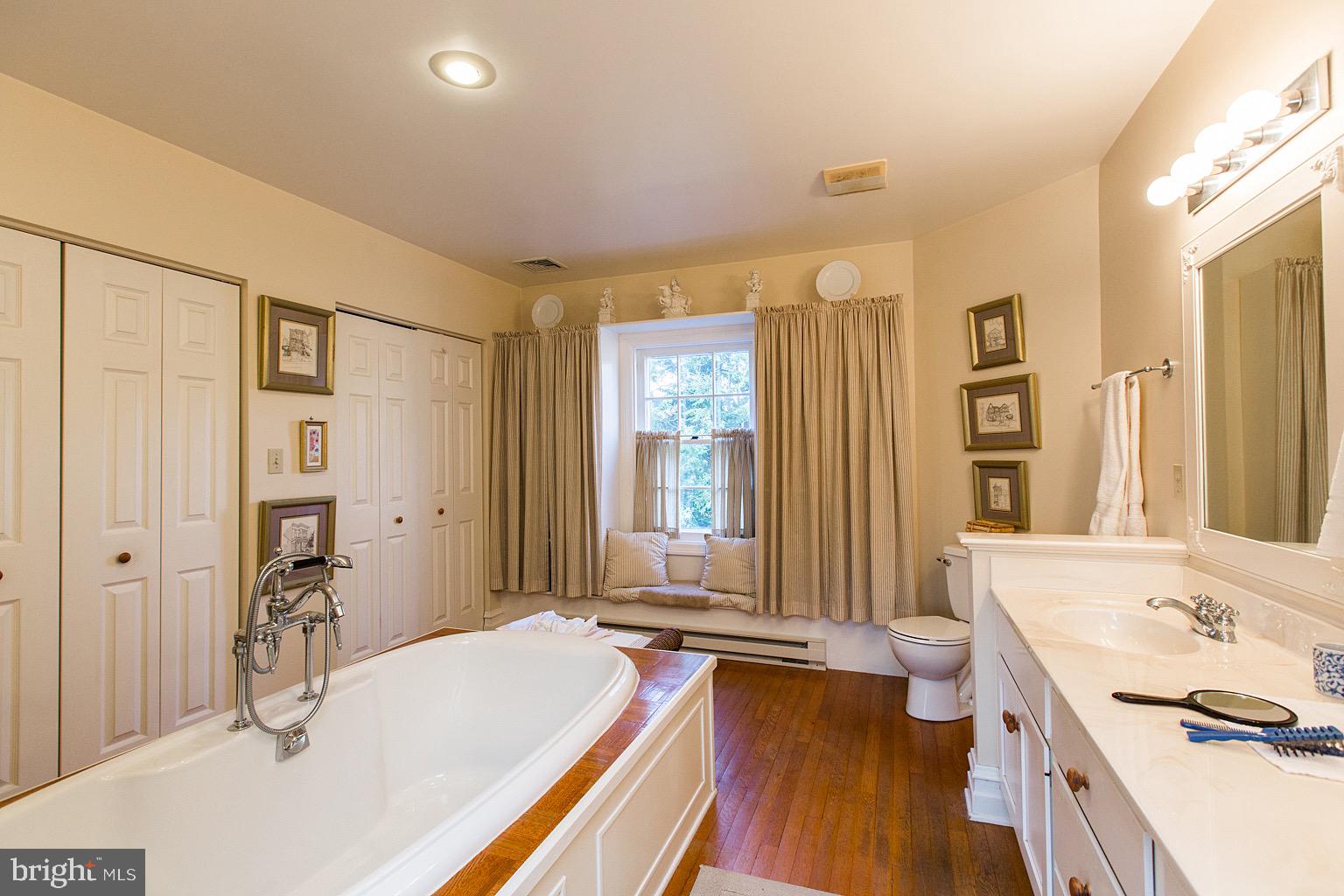 41 Hess Boulevard Lancaster, PA 17601 - Photo 40 of 63 a spacious bathroom with a tub a sink and a large mirror