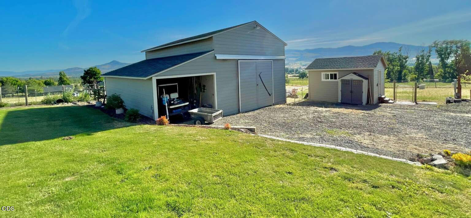 6085 Adams Road Talent, OR 97540 - Photo 37 of 40 a view of a house with backyard and garden