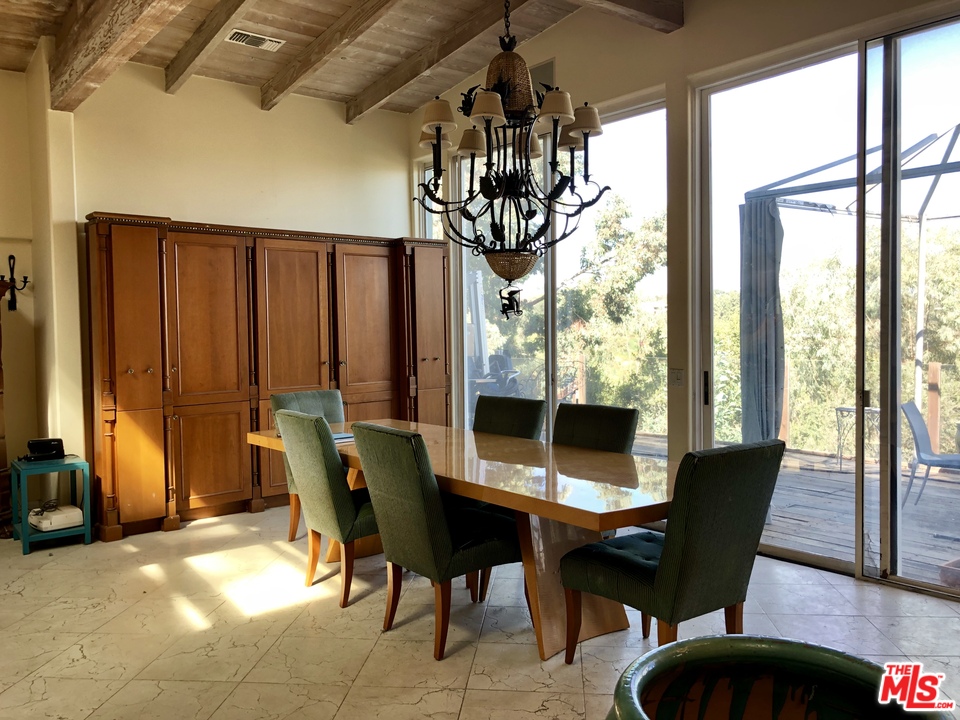 960 North Tigertail Road Los Angeles, CA 90049 - Photo 3 of 13 a view of a dining room with furniture window and outside view